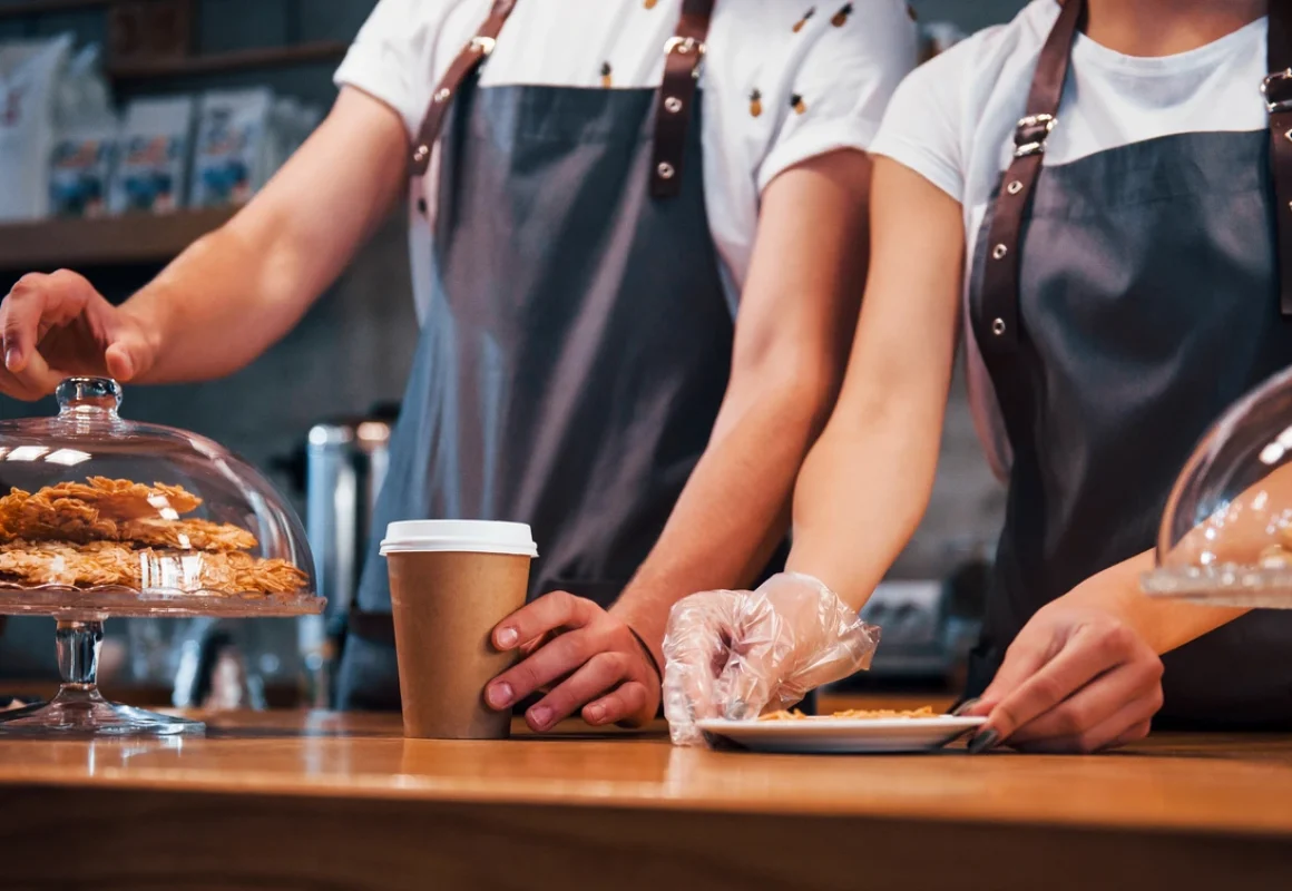 two-young-cafe-workers-indoors-conception-of-busi-2026-03-24-05-31-15-utc